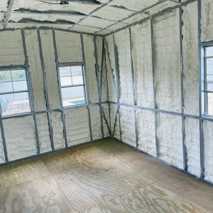 Closed-cell spray foam insulation applied to wall cavities in a residential project in Calverton